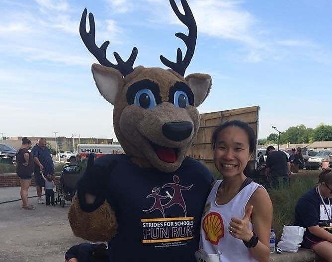 May standing with Deer mask person