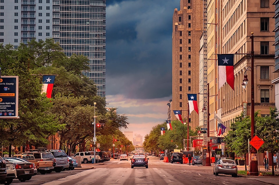 Down town Houston street scape with storm clouds in the distance.