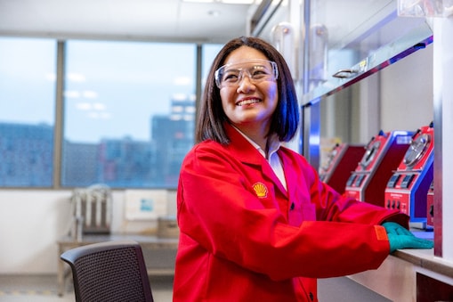 Female scientist wearing a red jumpsuit