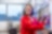 Female scientist wearing a red jumpsuit