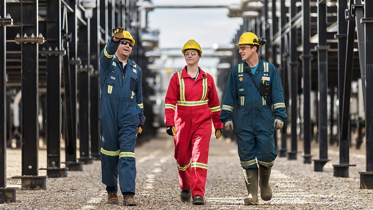 Shell engineers walking together at an operational site