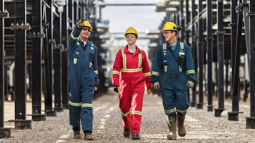 Shell engineers walking together at an operational site