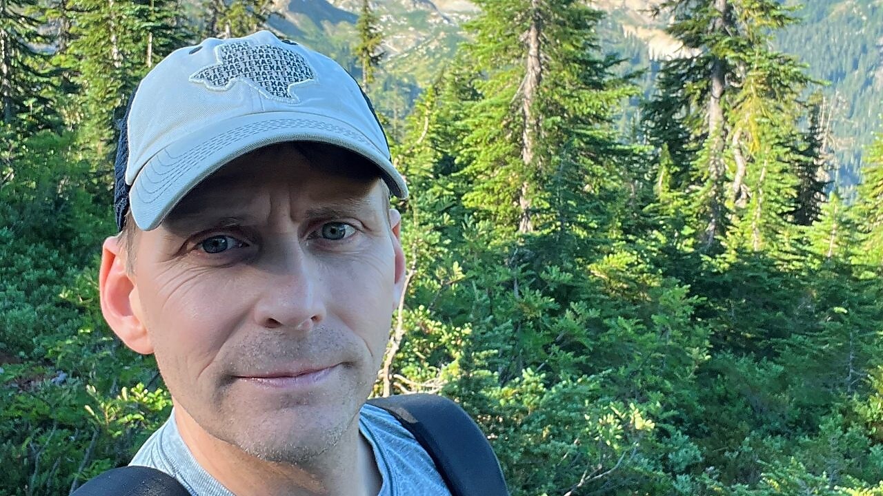 Selfie of a man on a hike trail