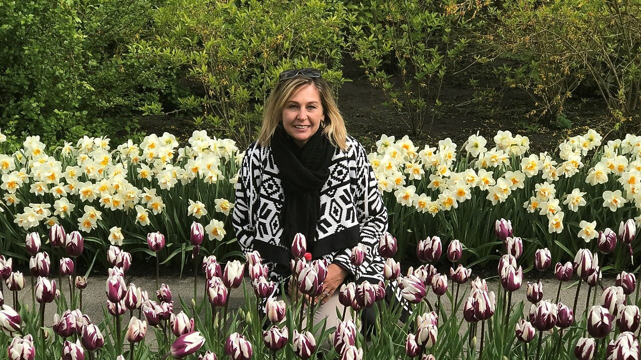 woman posing in a tulip field
