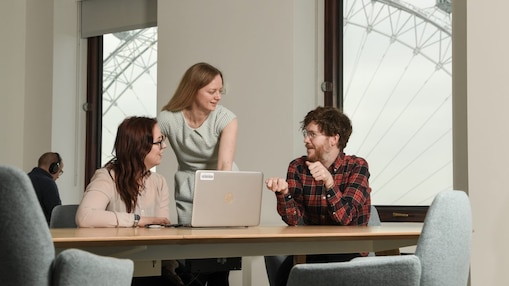 Shell employees in London huddled around a laptop.