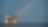 A Shell offshore rig with a rainbow in the background.
