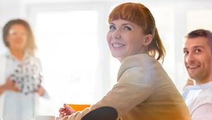 two colleagues looking at a computer screen