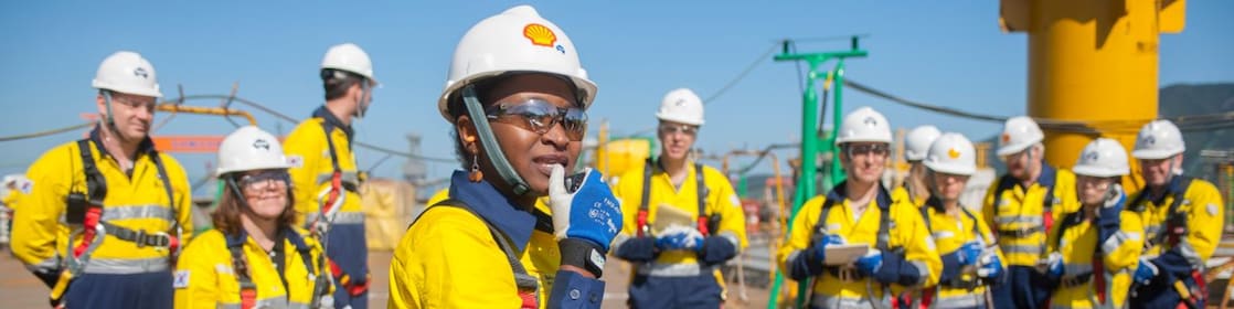 A female Shell engineer leading her team at an operational site.