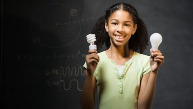 Girl holding light bulbs