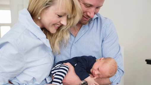 Claire Punins and her husband Robin, holding their son James
