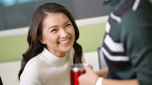 A young Shell female employee smiling.