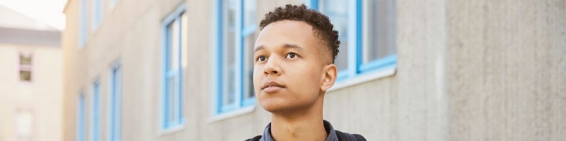 a male student wearing a backpack