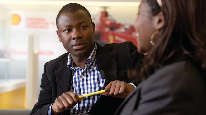 two individuals discussing