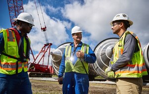 Shell engineers meeting at an operational site.
