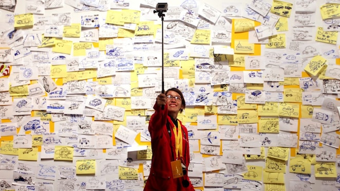 Visitors post 'ideas' on an interactive wall at the 'Experience' during day four of the Shell Eco-marathon in Manila, Philippines, Sunday, March 1, 2015.