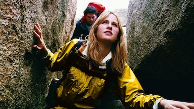 Two People Orienteering Between Rocks