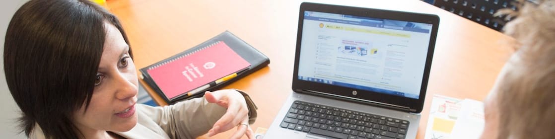 Women discussing project details with Man