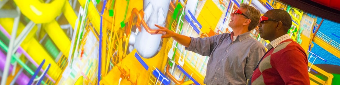 two man watching big screen with 3d glasses