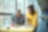 Two architects discussing project at high table