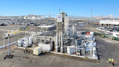 Heavy duty hydrogen fuel-cell electric truck and Toyota Mirai in front of Toyota Logistics Services