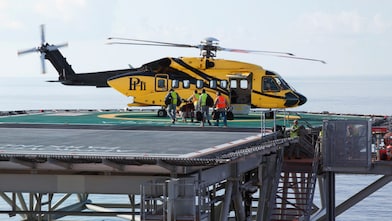 Helicopter taking off during cargo load