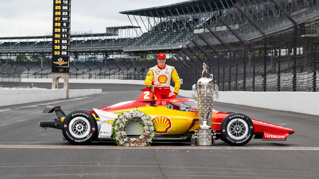 Newgarden with the winner's wreath and Borg-Warner Trophy.