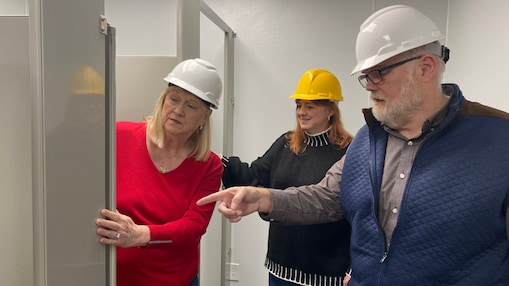 a group of people in hard hats 