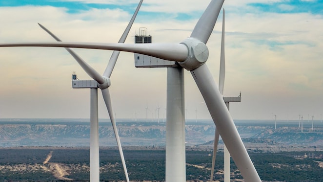 Three wind turbines in a field