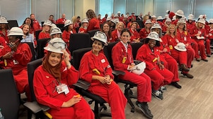 Room of Women Business Owners wearing Shell red PPE