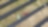 overhead view of farming tractor pulling a combine between rows of solar panels.