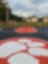 wide shot of kids playing on new basketball court.