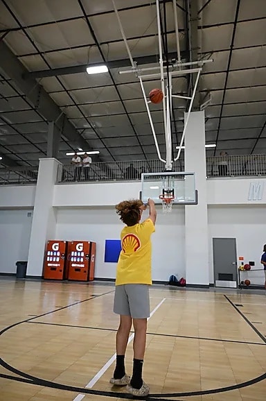 youth shooting a basketball