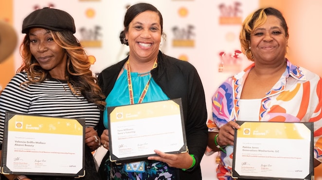 group of women holding certificates