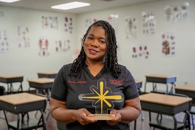 woman holding trophy