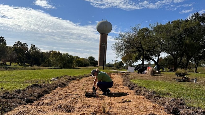 Deborah January-Bevers plants a bioswale in Pasadena, Texas