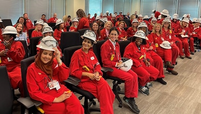 Room of Women Business Owners wearing Shell red PPE