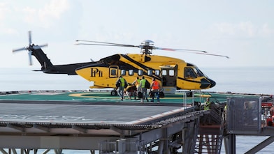 Helicopter taking off during cargo load
