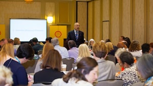 A man informs a group in a seminar