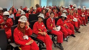 Room of Women Business Owners wearing Shell red PPE