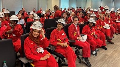 Room of Women Business Owners wearing Shell red PPE