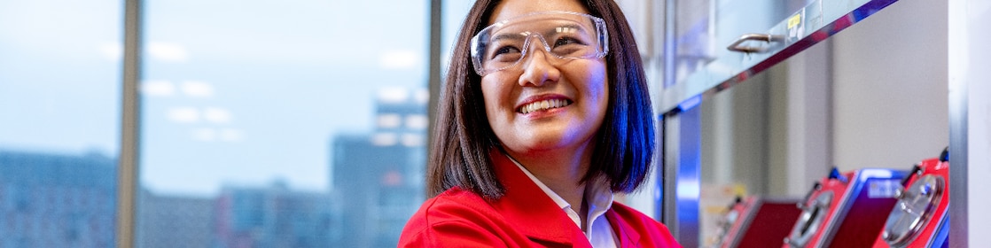 Female scientist wearing a red jumpsuit