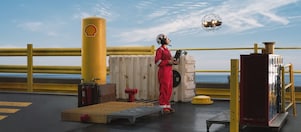 Shell worker operating drone