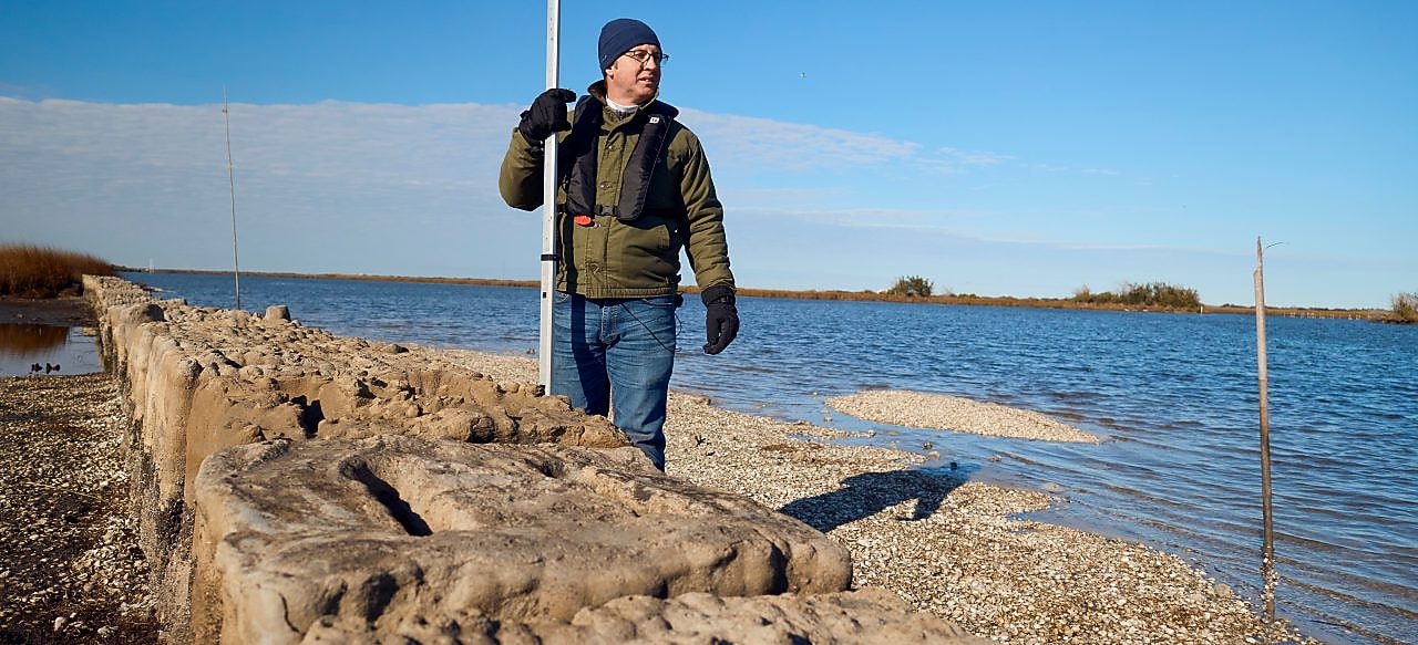 Man standing behind 3-D printed reef