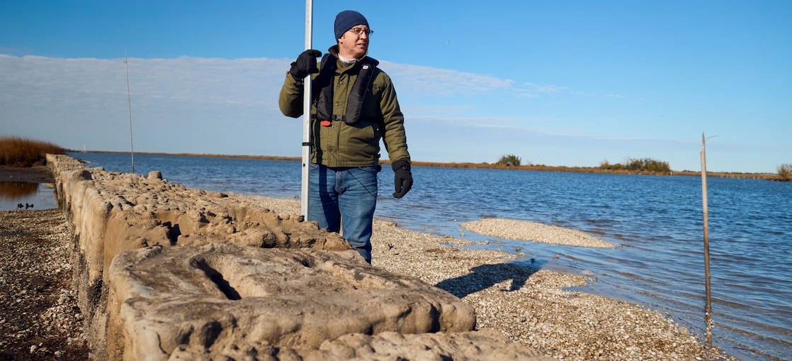 Man standing behind 3-D printed reef