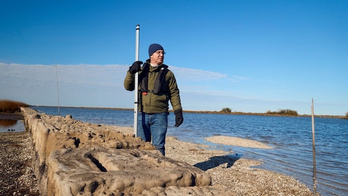 Man standing behind 3-D printed reef