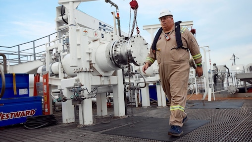 Man walking on barge platform