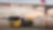 A man fueling a commercial airplane from a fuel truck at an airport