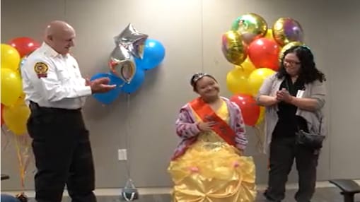 Paulina stand with mother and Fire Chief after being crowned Shell Deer Park Princess for the Day.
