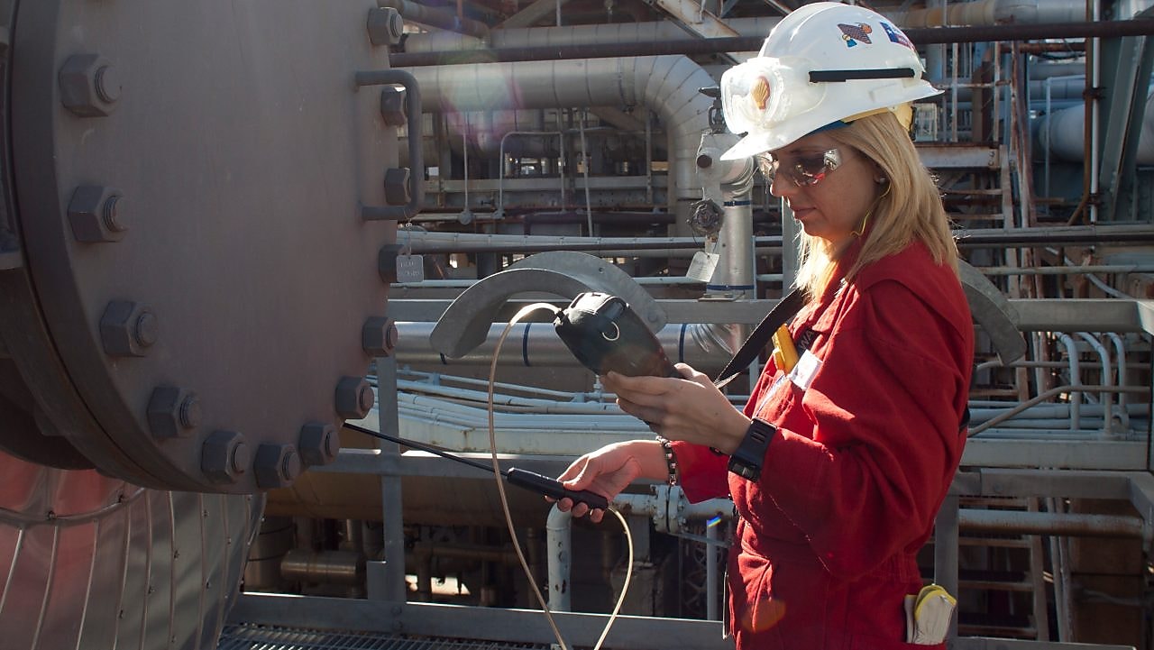 A woman checking the instrument
