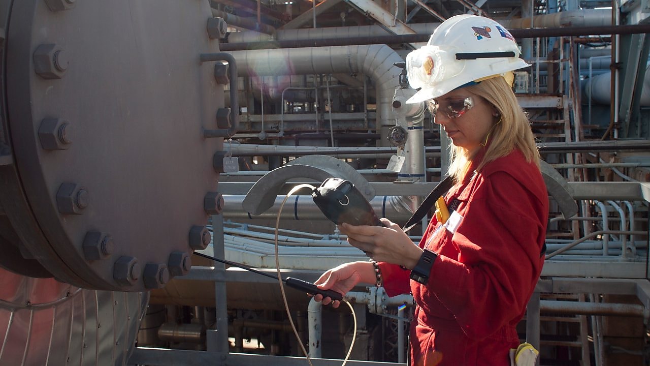 A woman checking the instrument